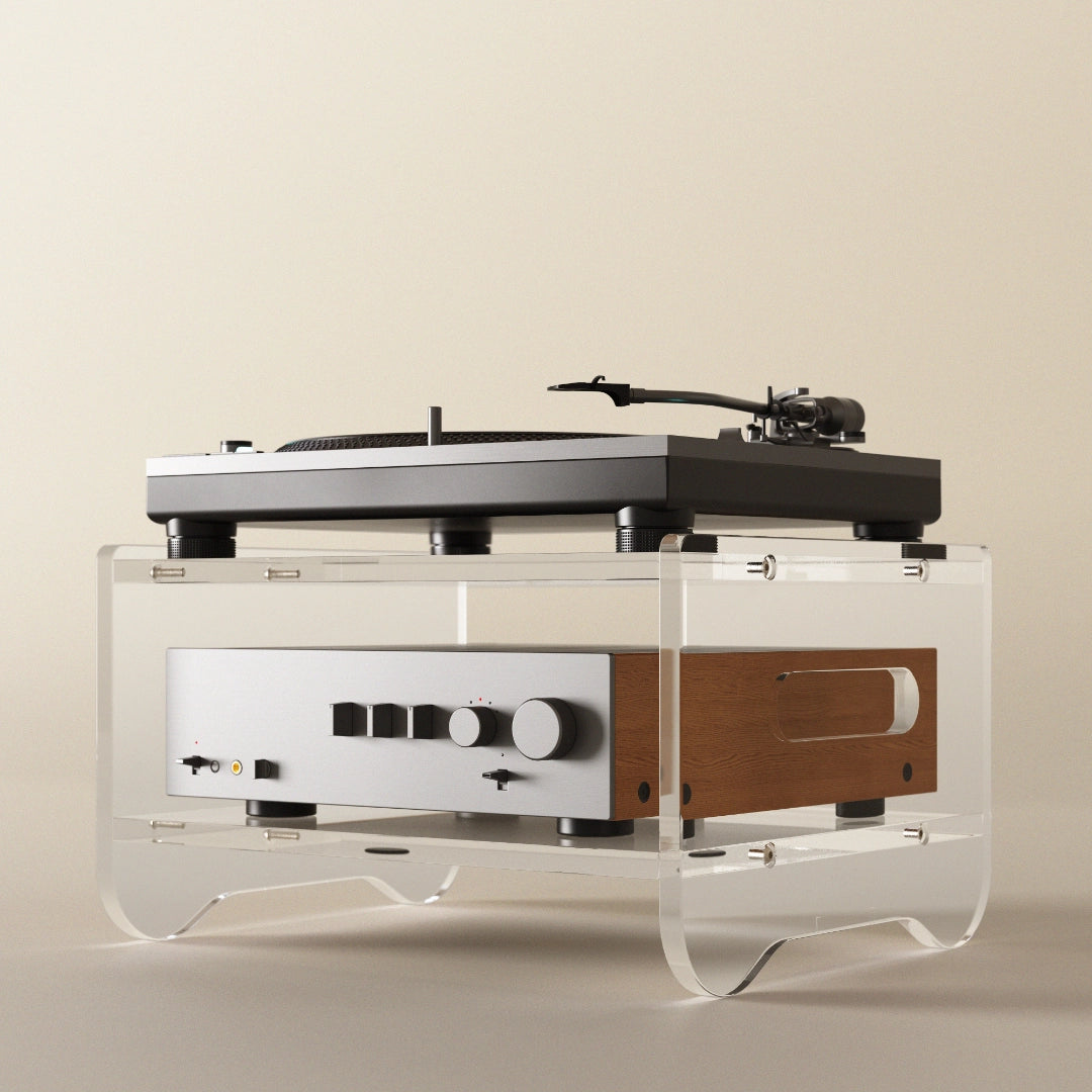 Modern turntable with clear acrylic base on a beige background